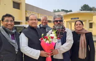 Bishop Louis Mascarenhas of Allahabad greets Father Babu Francis at the gate of Naini jail in Prayagraj district with a bouquet of flowers. Credit: Diocese of Allahabad