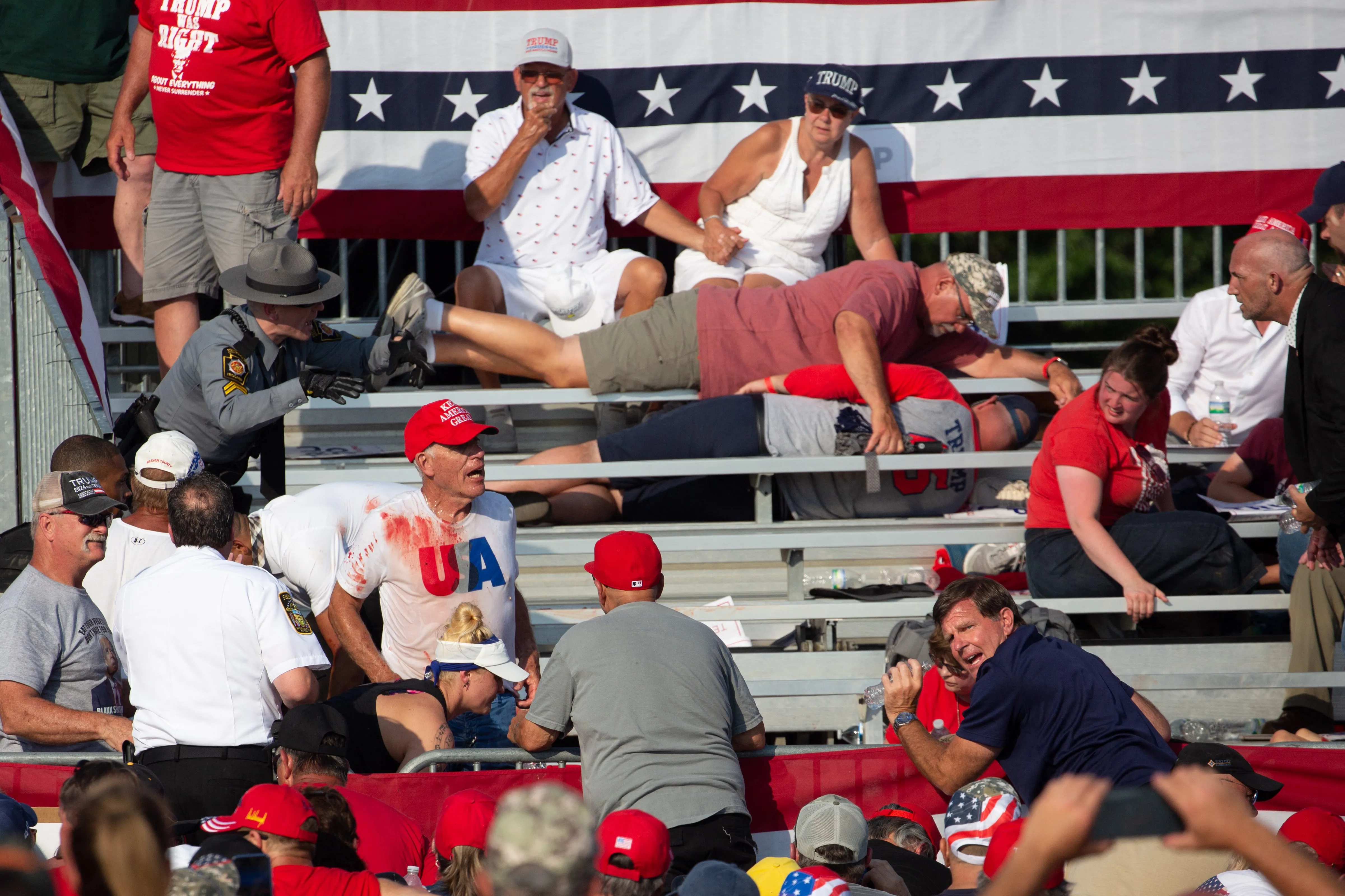 Trump supporters are seen covered with blood in the stands in aftermath of assassination attempt against former President Donald Trump in Butler, Pennsylvania, July 13, 2024.?w=200&h=150