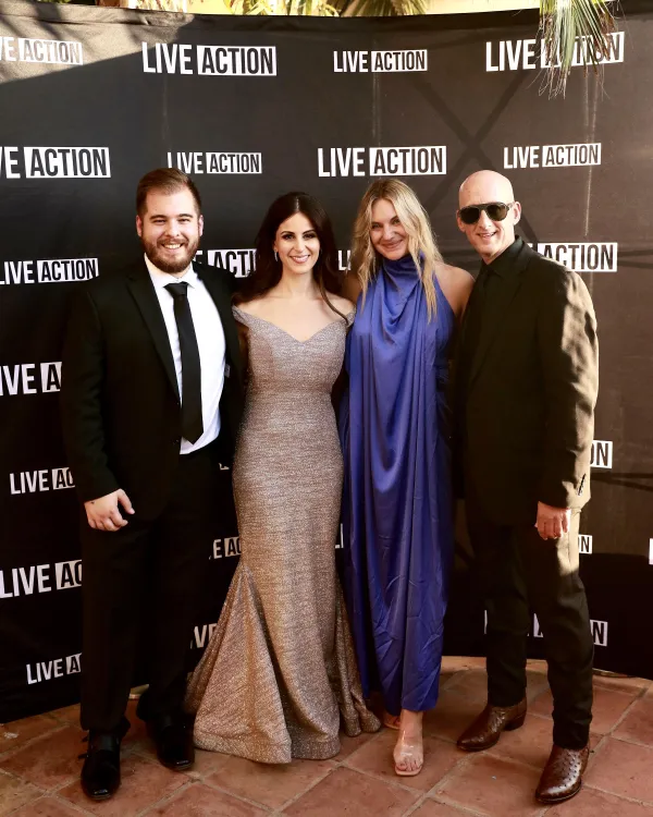 Pro-life photojournalist Mark Story (far right) attends an event with Live Action founder and president Lila Rose (second from left). In a statement mourning his July 17, 2024, passing, Rose said that Story “passionately served the pro-life movement for the last five years, exposing millions to the truth about abortion through his creative photography.” According to Rose, “his incredible talent and gentle spirit of joy and service touched everyone who was blessed to work with him. He will be sorely missed.” Credit: Photo courtesy of Live Action