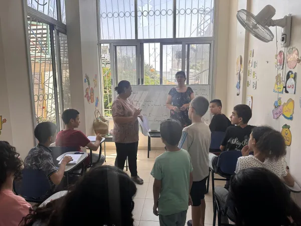 Some children and teenagers from Gaza during a lesson on the veranda of the Sisters of the Incarnate Word house inside the compound of the Latin parish. “Engaging in studies helps to avoid thinking and talking only about the war, to not focus solely on the conflict. It is a small seed of hope,” Father Gabriel Romanelli explained to CNA. Credit: Photo courtesy of Father Gabriel Romanelli