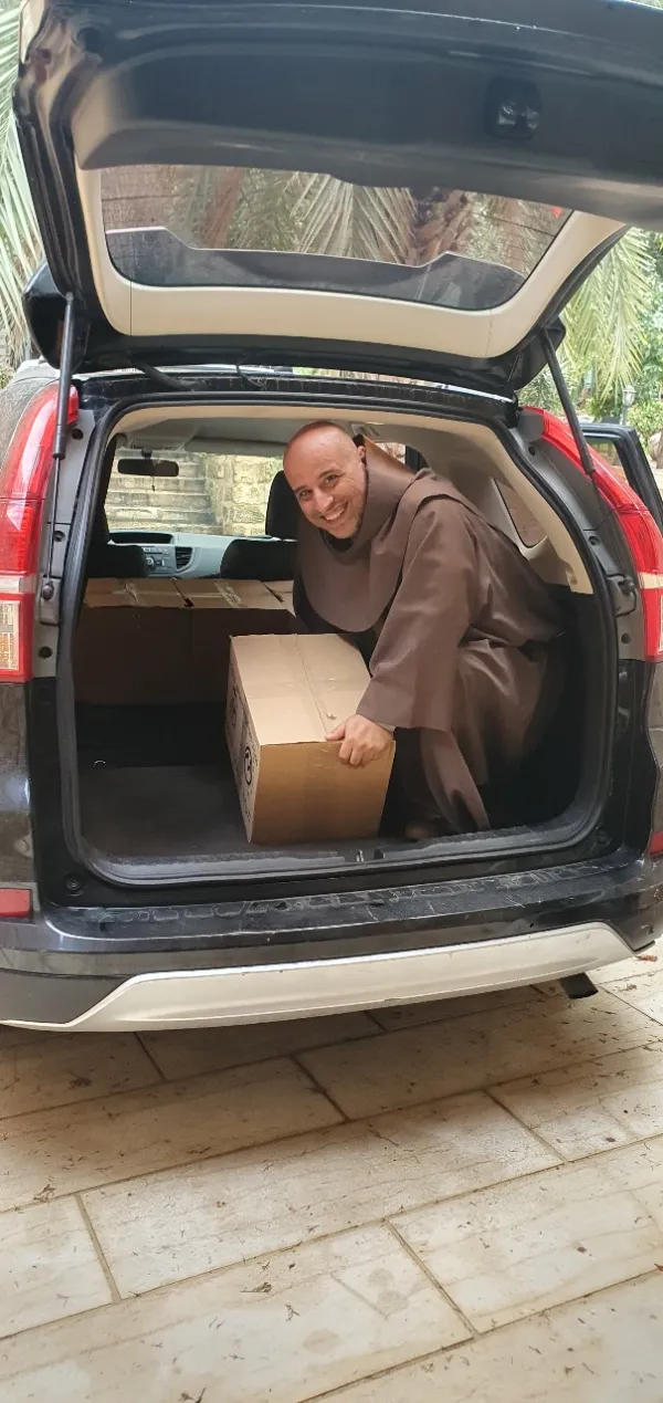 The Franciscan friar Father Toufic Bou Mehri, while bringing food parcels to the families of Deir Mimas, a little Lebanese village 4 kilometers from the Israeli border. The groceries are purchased with the support of the Apostolic Vicariate of Beirut and of the association Pro Terra Sancta, affiliated with the Custody of the Holy Land. Courtesy of Father Toufic Bou Mehri