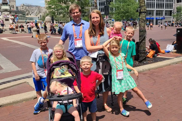 Alec and Frannie Moen, from the St. Louis area, and their seven children await the start of the Eucharistic procession at the National Eucharistic Congress. Credit: Photo courtesy of Frannie Moen