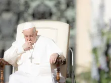 Pope Francis prays at his Wednesday audience in St. Peter’s Square on April 12, 2023.