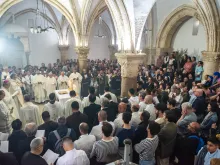 The Catholic faithful gathered in the Cenacle in Jerusalem for the Mass of the Lord's Supper that the Franciscan friars celebrated on Holy Thursday, March 28, 2024. The Cenacle is at the center of strong tensions and disputes regarding ownership and rights of access and celebration. An ancient tradition places King David’s tomb here and over the centuries Jews and Muslims have leveraged this to first expel the Franciscans and then to prevent Christian worship, which they deemed sacrilegious.