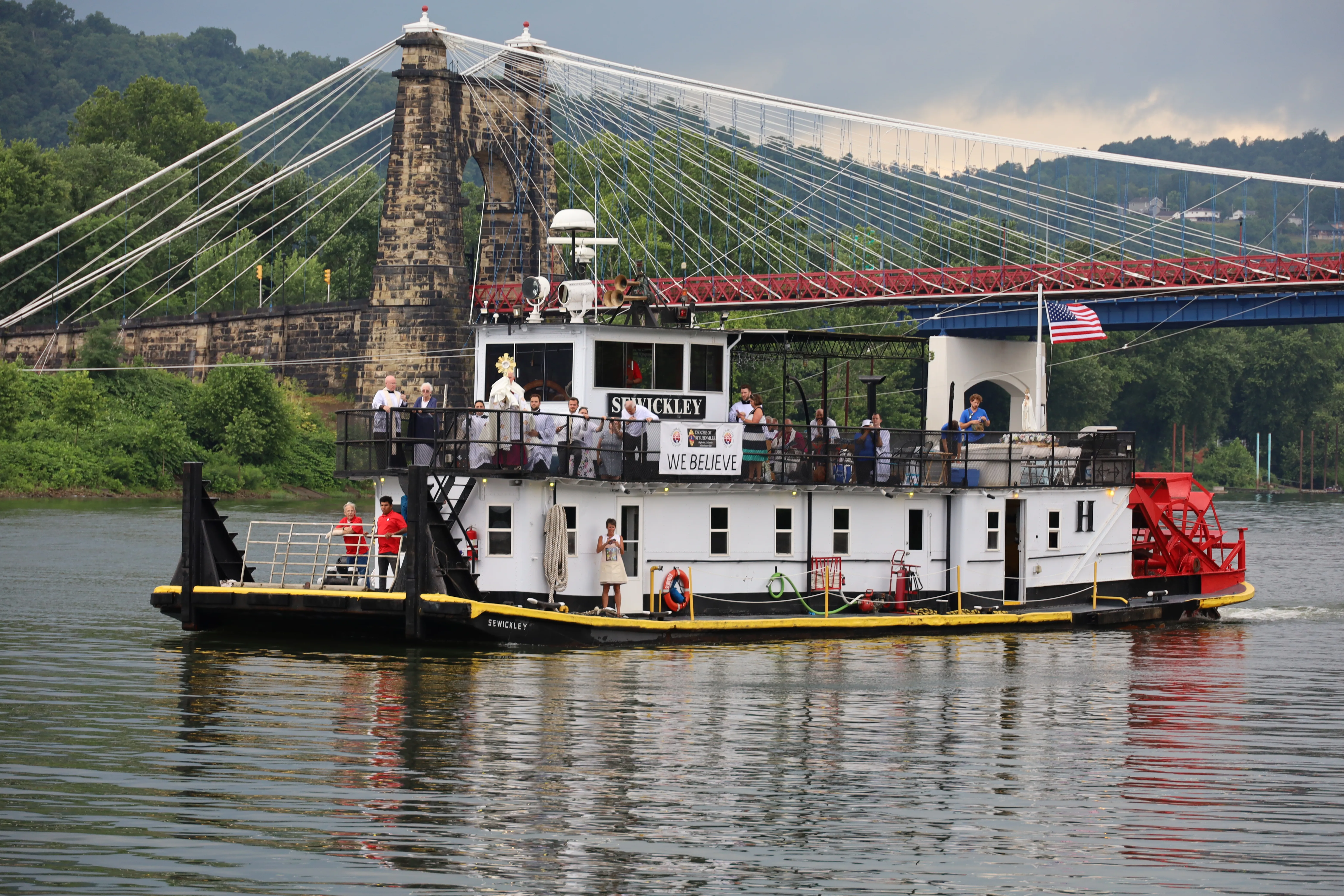 Father Roger Landry displays the Blessed Sacrament aboard the vessel "Sewickley" on the Ohio River near Steubenville, Sunday, June 23, 2024.?w=200&h=150