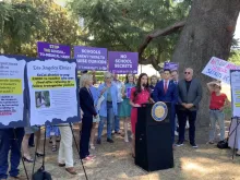 Sonja Shaw (center), president of the Chino Valley Unified School District in California, speaks at a press conference before the education committee hearing in the assembly on June 26, 2024.