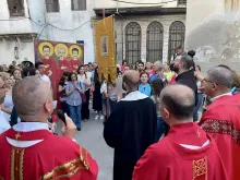 A moment of prayer during the procession through the narrow streets of the Christian quarter of Bab-Touma (St. Paul) in the Old City of Damascus on July 9, 2023, in celebration of the liturgical feast of the Martyrs of Damascus.