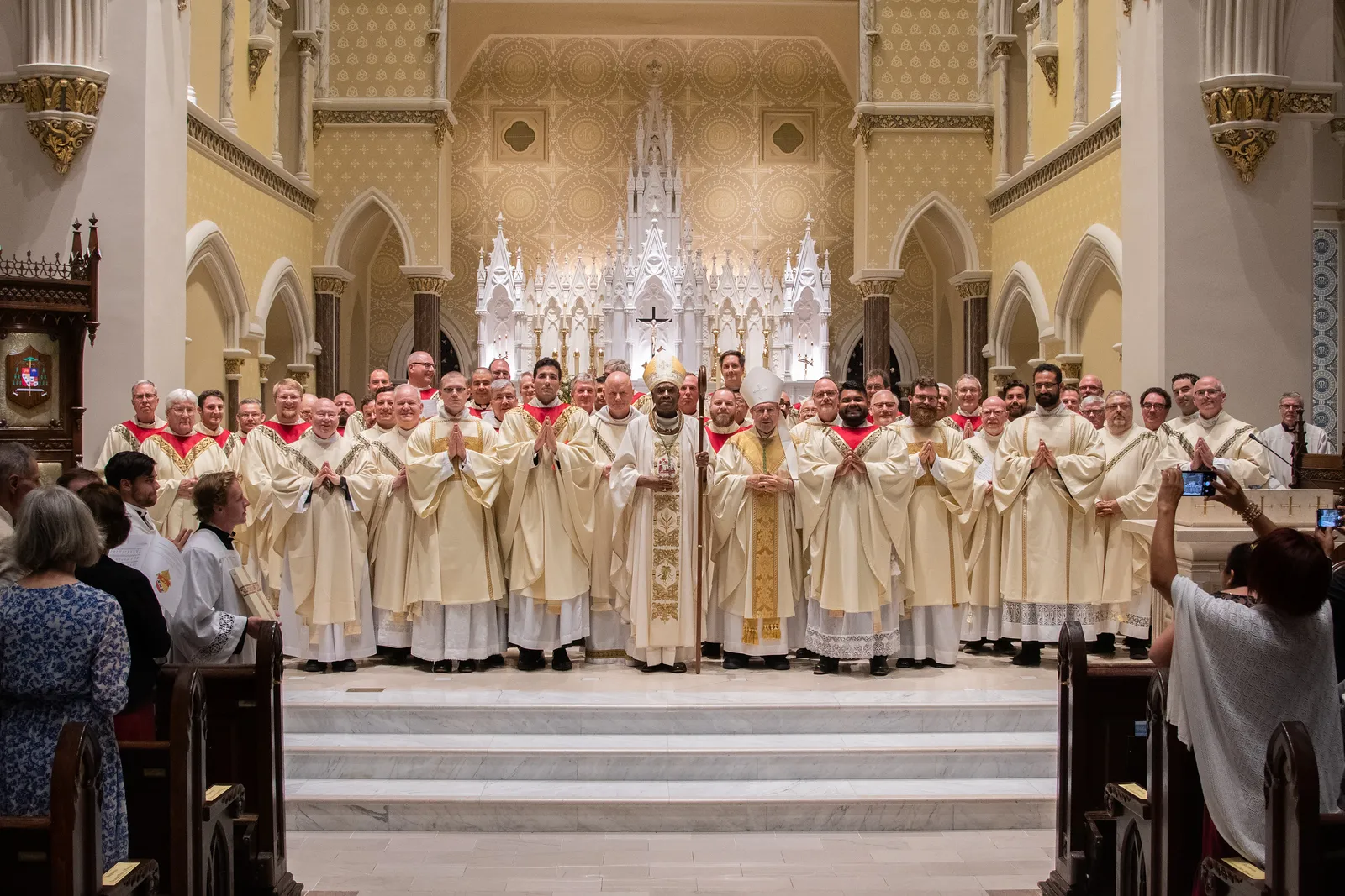 Bishop Jacques Fabre-Jeune poses alongside many of the priests of the Diocese of Charleston at a recent ordination. The diocese has seen a recent surge in vocations.?w=200&h=150