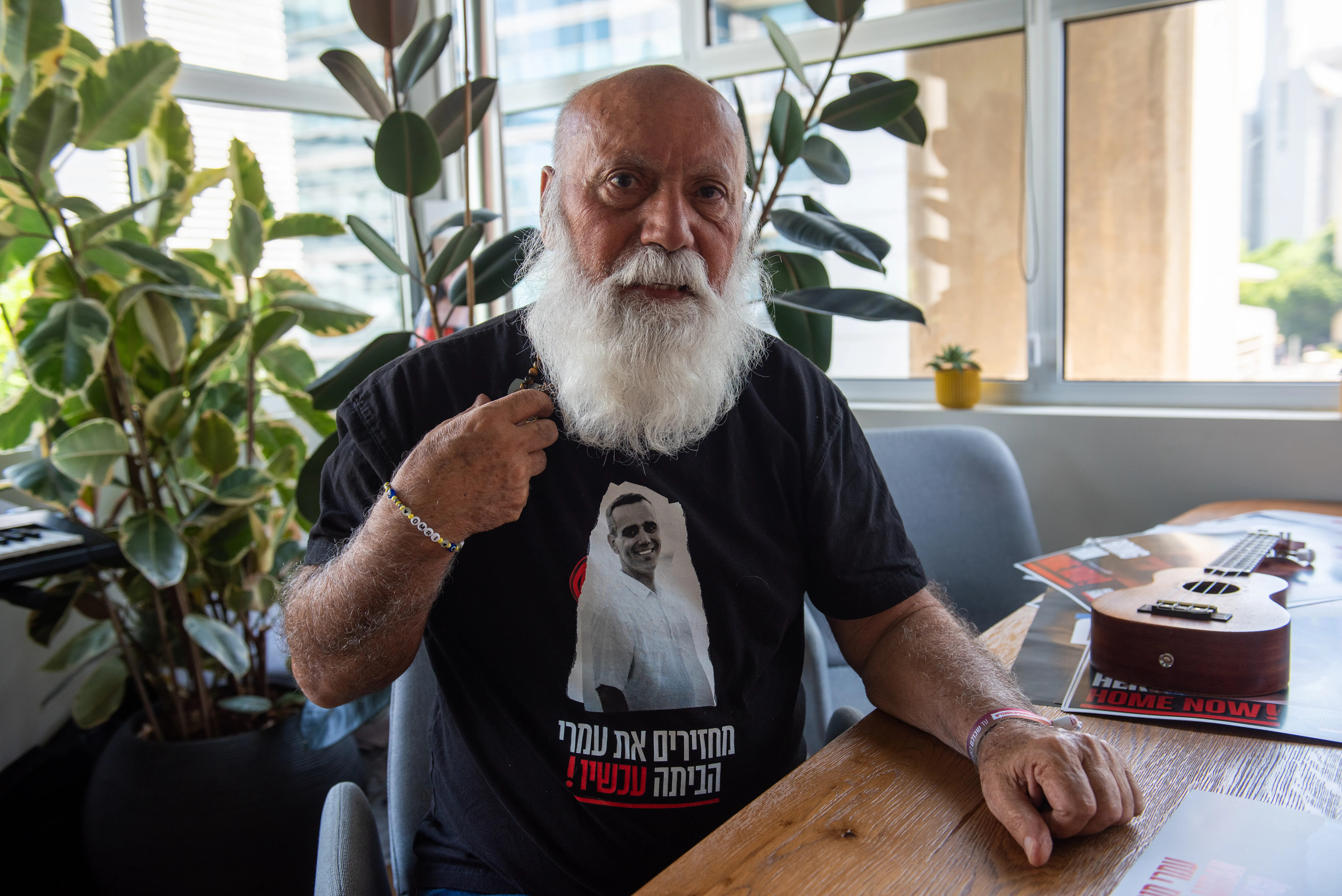 Danny Miran shows the T-shirt with a photo of his son Omri, one of the Israelis kidnapped on Oct. 7, 2023, and who is still being held hostage in Gaza. On the T-shirt, the Hebrew inscription reads: “Bring them home now!”, the motto of the campaign to bring back the hostages. A few days after Oct. 7, Danny Miran, 79, left his home in northern Israel and joined the Hostages and Missing Families Forum in Tel Aviv. His life’s purpose has become bringing his son back home.?w=200&h=150