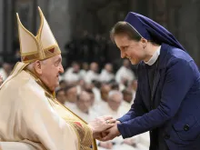 Pope Francis greets a woman religious at a Mass on the World Day of Consecrated Life, the feast of the Presentation of the Lord, on Feb. 2, 2024, in St. Peter's Basilica at the Vatican.