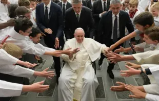 Pope Francis greets altar servers from France. Credit: Vatican Media