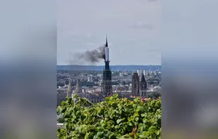 Smoke billows from the spire of Rouen Cathedral in Rouen, northern France, on July 11, 2024. Credit: PATRICK STREIFF/AFP via Getty Images