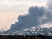 Smoke billows over the northern Gaza Strip during Israeli bombardment from southern Israel on Dec.14, 2023, amid continuing battles between Israel and the Palestinian militant group Hamas.