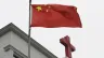 This photo taken on Jan. 15, 2024, shows a Chinese flag fluttering below a cross on a Christian church in Pingtan in China’s southeast Fujian province.