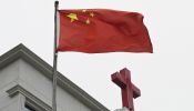 This photo taken on Jan. 15, 2024, shows a Chinese flag fluttering below a cross on a Christian church in Pingtan in China’s southeast Fujian province.