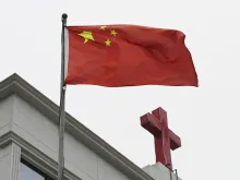 This photo taken on Jan. 15, 2024, shows a Chinese flag fluttering below a cross on a Christian church in Pingtan in China’s southeast Fujian province.