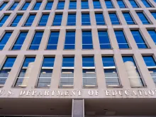 The U.S. Department of Education sign hangs over the entrance to the federal building housing the agency's headquarters on Feb. 9, 2024, in Washington, D.C.