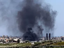 A picture taken from a position in southern Israel on Feb. 29, 2024, shows smoke billowing over the Gaza Strip amid ongoing battles between Israel and the Palestinian militant group Hamas.