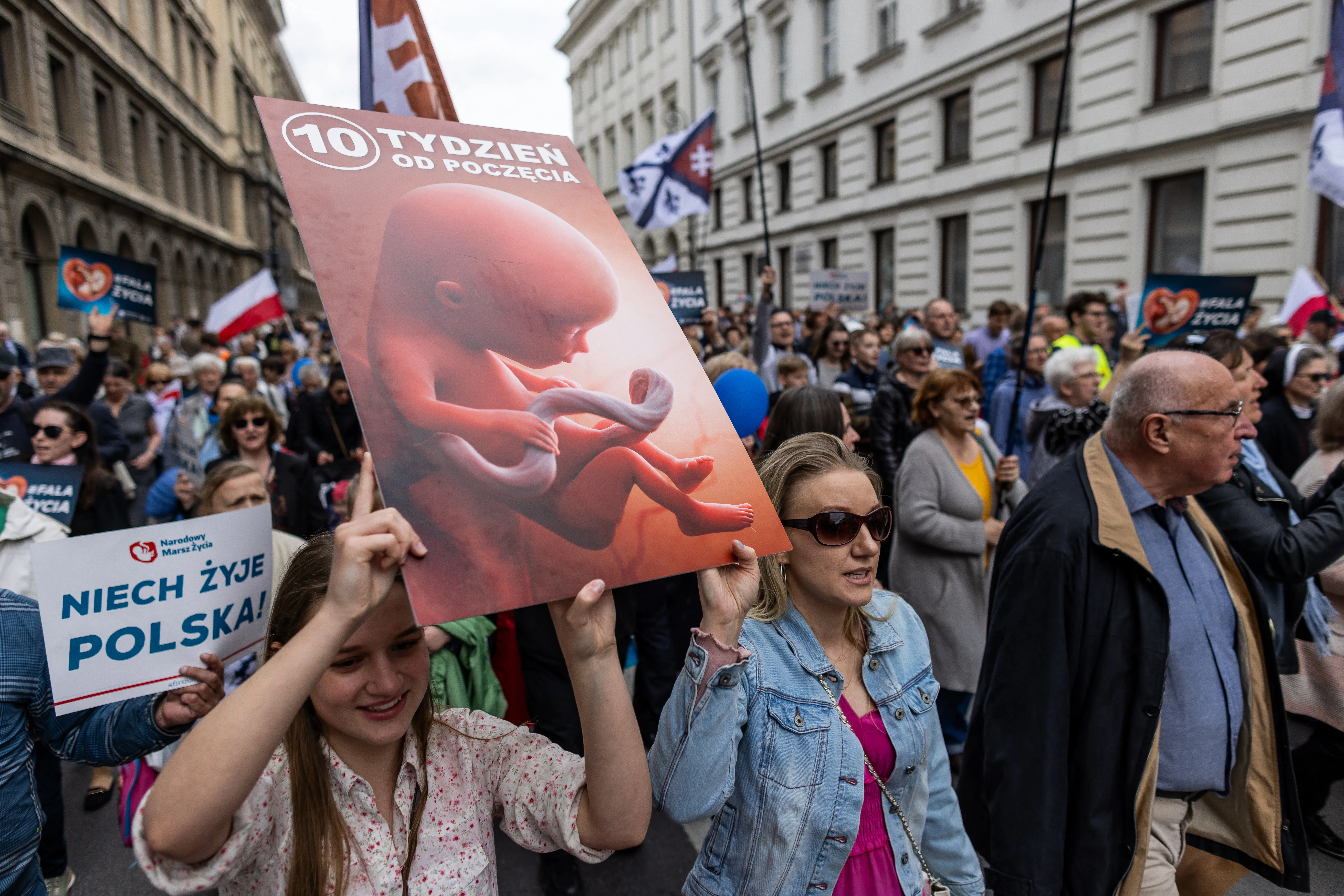 Protesters hold a placard depicting an unborn baby as they take part in the March of Life in Warsaw, on April 14, 2024.?w=200&h=150