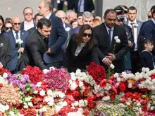 Attendees lay flowers at the Tsitsernakaberd Armenian Genocide Memorial in Yerevan to mark the 109th anniversary of World War I-era mass killings on April 24, 2024.