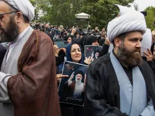 People participate in a funeral procession of president Ebrahim Raisi and his seven aides in Tabriz, East Azerbaijan province, on May 21, 2024.