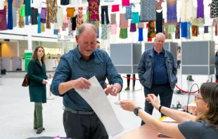 A man receives his ballot for the European elections in a polling station in The Hague on June 6, 2024, on the first day of the European Parliament election. Credit: Nick Gammon/AFP via Getty Images