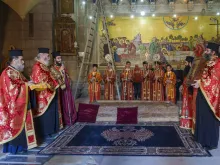 Some Greek Orthodox monks at the entrance of the Church of the Holy Sepulcher wait for the solemn entrance of the patriarch on Saturday, March 23, 2024, for the First Vesper of the first Sunday of Lent, called the "Sunday of Orthodoxy."