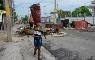 People flee their neighborhoods on May 2, 2024, after armed gangs terrorized the Delmas 24 and Solino areas on the night of May 1 in Port-au-Prince, Haiti. Credit: CLARENS SIFFROY/AFP via Getty Images