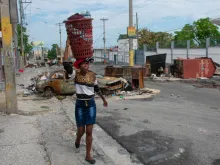 People flee their neighborhoods on May 2, 2024, after armed gangs terrorized the Delmas 24 and Solino areas on the night of May 1 in Port-au-Prince, Haiti.