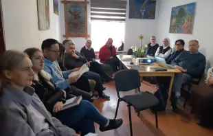 The Apostolic Administration in Bishkek, Kyrgyzstan, made up of priests, religious, and laypeople, gather in Bishkek, Kyrgyzstan, during Easter Week, April 2-3, 2024, to pray and discuss the work of the small but growing  Catholic community spread throughout the Central Asian country. Father Anthony Corcoran (pictured in glasses holding a blue pen and paper) and Caritas representative Sher Abdugapirov (glasses and light blue hoodie) can be seen in this photo. Credit: Father Remisgiuz Kalski, SJ