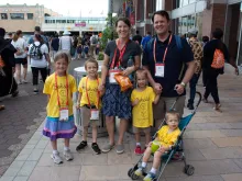 Steven and Joelle Schlotter, from Louisville, Kentucky, created special homemade T-shirts for their children in honor of the National Eucharistic Congress.