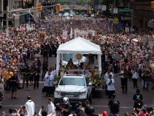 The Eucharist and the crowd for the procession as part of the National Eucharistic Congress in Indianapolis.