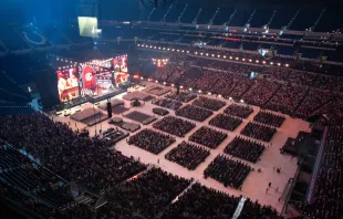 More than 50,000 kneel in adoration of the Eucharist at the National Eucharistic Congress at Lucas Oil Stadium in Indianapolis on July 18, 2024. Credit: Jeffrey Bruno