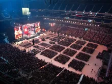 More than 50,000 kneel in adoration of the Eucharist at the National Eucharistic Congress at Lucas Oil Stadium in Indianapolis on July 18, 2024.