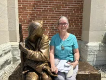 Christina Wheatley, a cancer survivor, in front of St. John the Evangelist Catholic Church in Indianapolis, where a welcome Mass was held July 16, 2024, to kick off the National Eucharistic Congress.