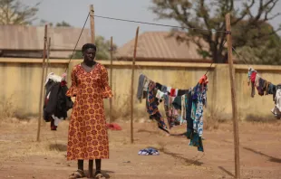 A Christian woman stands next to a clothesline while taking refuge in an internally displaced persons (IDP) camp at the Pilot Primary School after their houses were burnt as a result of religious strife in Mangu on Feb. 2, 2024, following weeks of intercommunal violence and unrest in the Plateau State. Credit: KOLA SULAIMON/AFP via Getty Images