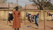A Christian woman stands next to a clothesline while taking refuge in an internally displaced persons (IDP) camp at the Pilot Primary School after their houses were burnt as a result of religious strife in Mangu on Feb. 2, 2024, following weeks of intercommunal violence and unrest in the Plateau State.