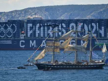 The French 19th-century three-masted barque Belem is seen from the Palais du Pharo in the southern port city of Marseille on May 8, 2024, before the Olympic Flame arrival ceremony, ahead of the Paris 2024 Olympic and Paralympic Games. The Belem is set to reach Marseille on May 8 and ten thousand torchbearers will then carry the flame across 64 French territories.