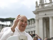 Pope Francis waves to pilgrims gathered in St. Peter’s Square for his Wednesday general audience on May 22, 2024, at the Vatican.