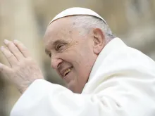 Pope Francis waves to pilgrims in St. Peter's Square gathered for his weekly general audience on April 3, 2024.