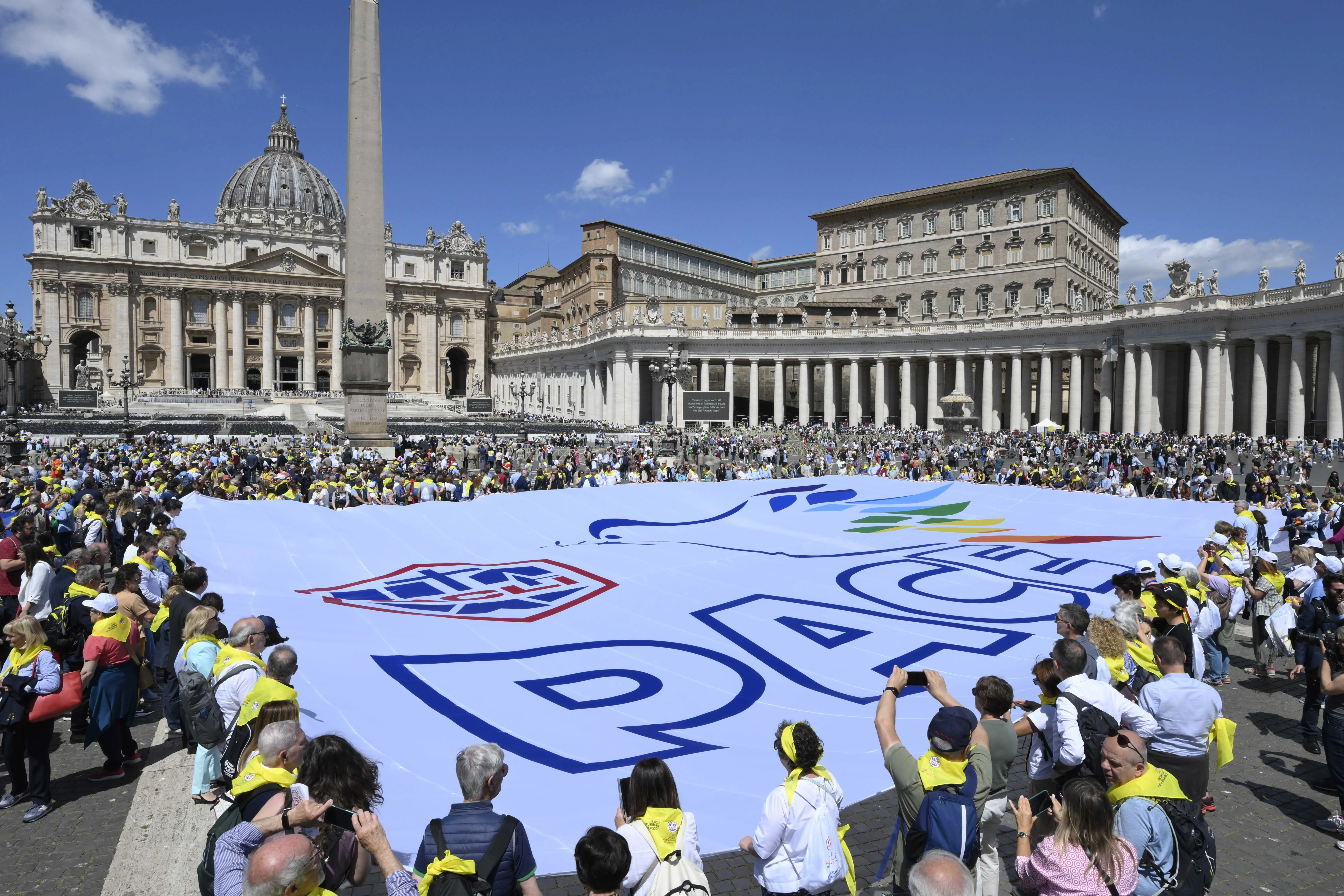 Members of ACLI (Italian Christian Workers' Associations) hold a sign with the word "peace" in Italian, in St. Peter's Square on June 1, 2024.?w=200&h=150