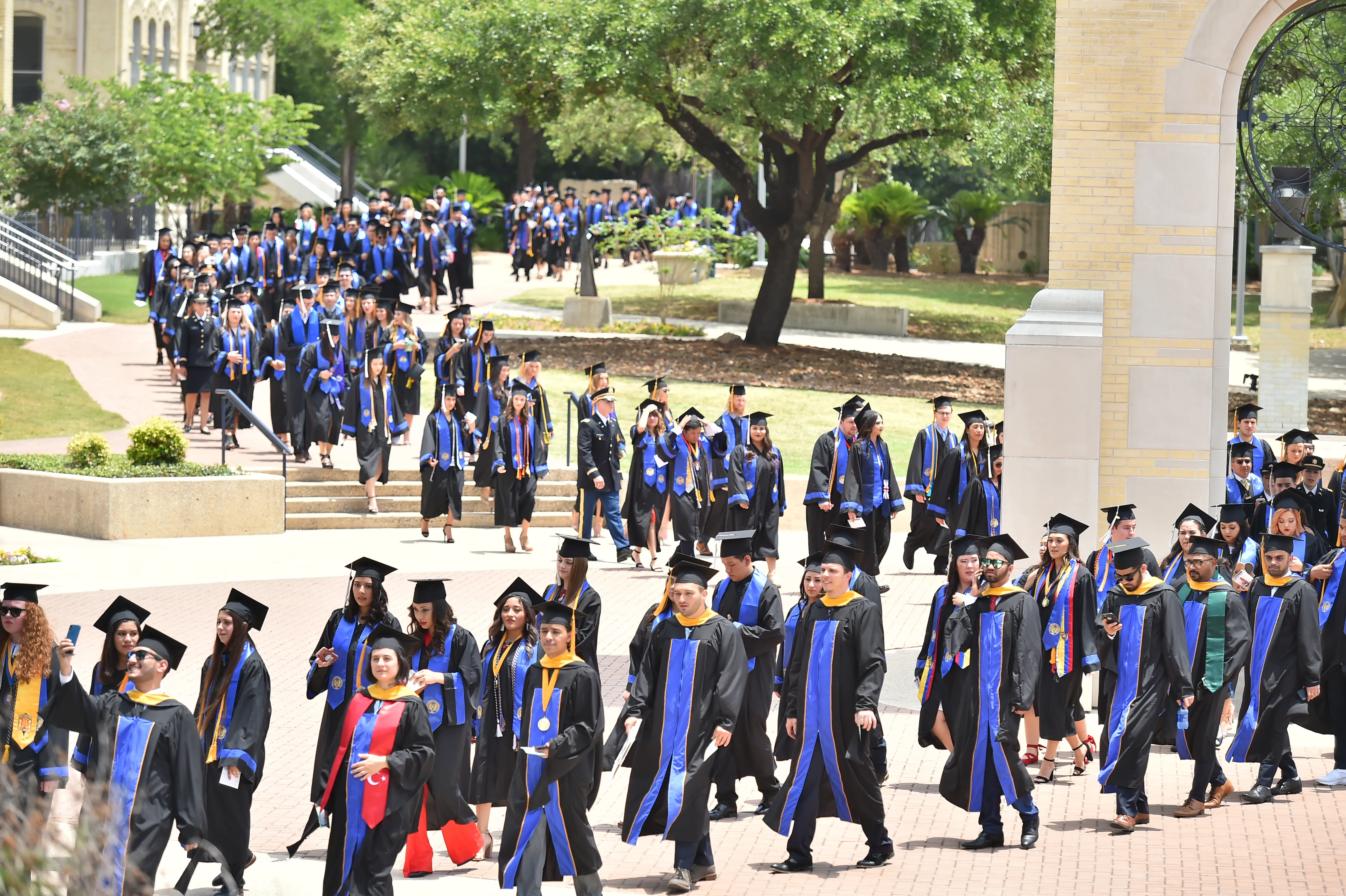 Graduates process across the historic St. Mary’s University campus in San Antonio toward their commencement ceremony in 2018.?w=200&h=150