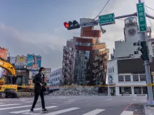 A person walks past an area of a damaged building that is cordoned off following a 7.5-magnitude earthquake on April 3, 2024, in Hualien, Taiwan.