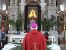 Archbishop Dionisio Guillermo García of Santiago de Cuba prays before an image of Mary in the Basilica National Sanctuary of Our Lady of Charity on March 24, 2024.